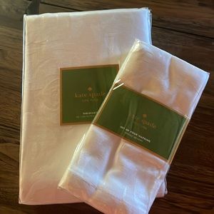 Kate spade tablecloth and napkins.  Coming up roses.